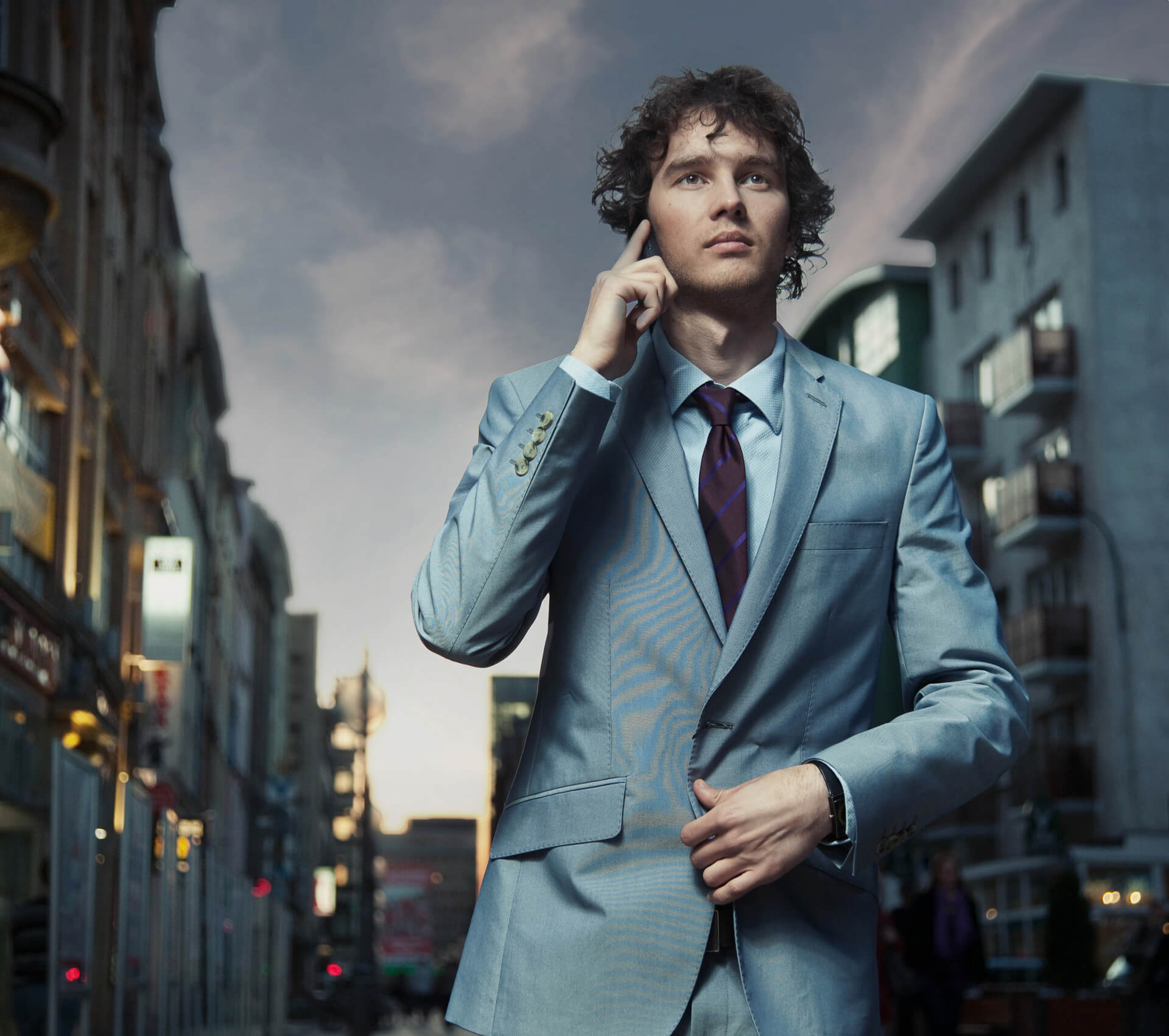 Kanzen.CZ Business Man on the phone in Czech street (background picture)